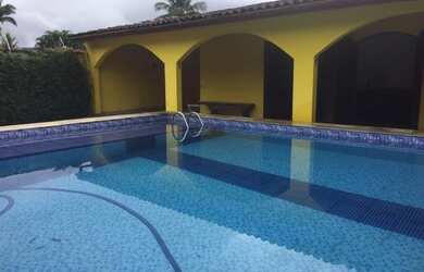 Imagem: A casa possui 4 Dormitórios, 4 Banheiros, 4 Vagas na garagem