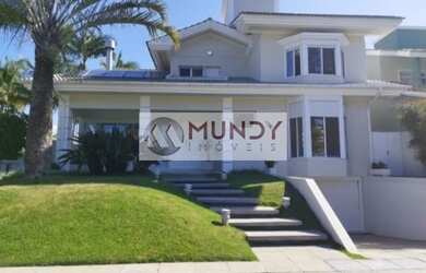 Imagem: A casa possui 5 Dormitórios, 5 Banheiros, 4 Vagas na garagem