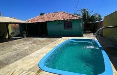 Imagem: A casa possui 2 Dormitórios, 3 Vagas na garagem e está localizado