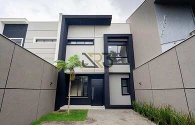 Imagem: A casa possui 3 Dormitórios, 2 Banheiros, 3 Vagas na garagem