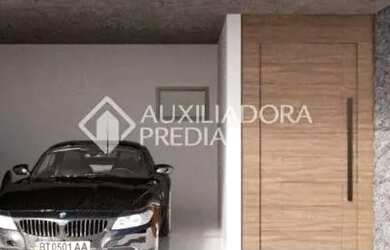 Imagem: A casa possui 3 Dormitórios, 2 Banheiros, 2 Vagas na garagem