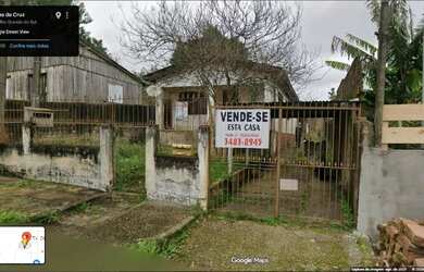 Imagem: A casa possui 4 Dormitórios, 2 Banheiros, 2 Vagas na garagem
