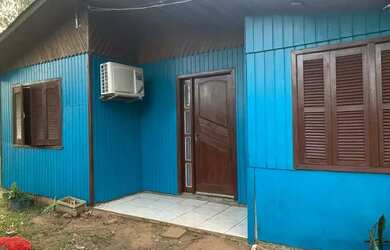 Imagem: A casa possui 3 Dormitórios, 3 Banheiros, 2 Vagas na garagem