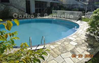 Imagem: A casa possui 4 Dormitórios, 4 Banheiros, 3 Vagas na garagem