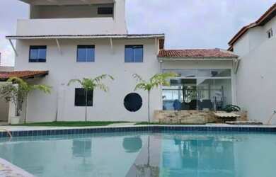 Imagem: A casa possui 4 Dormitórios, 3 Banheiros, 3 Vagas na garagem