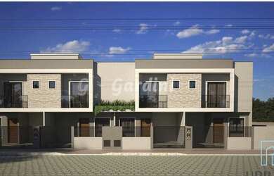 Imagem: A casa possui 2 Dormitórios, 3 Banheiros, 1 Vaga na garagem