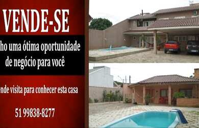 Imagem: A casa possui 3 Dormitórios, 3 Banheiros, 2 Vagas na garagem