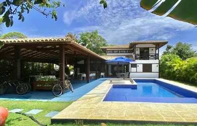 Imagem: A casa possui 5 Dormitórios, 5 Banheiros, 4 Vagas na garagem