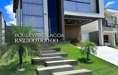 Imagem: A casa possui 3 Dormitórios, 3 Banheiros, 4 Vagas na garagem