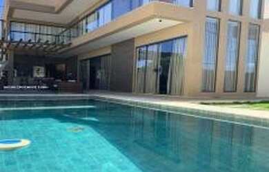 Imagem: A casa em condomínio possui 4 Dormitórios, 4 Banheiros, 4