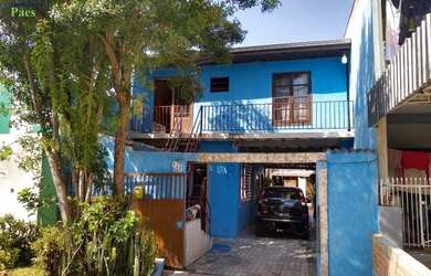 Imagem: A casa possui 4 Dormitórios, 3 Banheiros, 5 Vagas na garagem