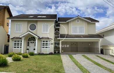 Imagem: A casa possui 4 Dormitórios, 5 Banheiros, 5 Vagas na garagem