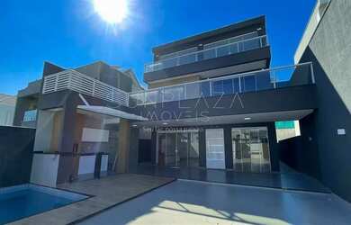 Imagem: A casa possui 4 Dormitórios, 5 Banheiros, 2 Vagas na garagem