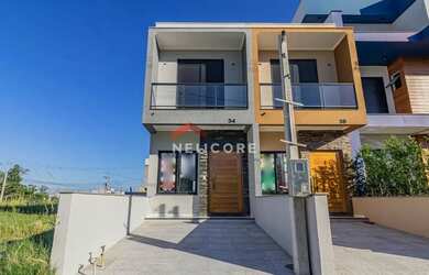 Imagem: A casa possui 2 Dormitórios, 3 Banheiros, 1 Vaga na garagem