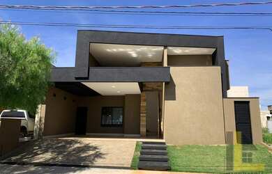 Imagem: A casa possui 3 Dormitórios, 5 Banheiros, 2 Vagas na garagem