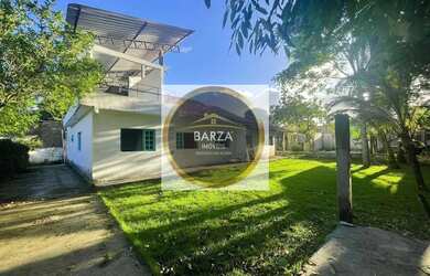 Imagem: A casa possui 4 Dormitórios, 3 Banheiros, 4 Vagas na garagem