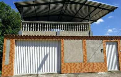 Imagem: A casa possui 3 Dormitórios, 4 Banheiros, 2 Vagas na garagem