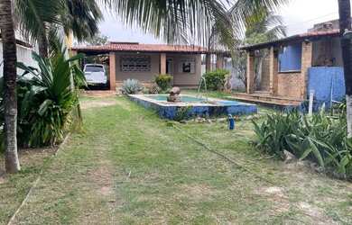 Imagem: A casa possui 3 Dormitórios, 3 Banheiros, 5 Vagas na garagem