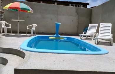 Imagem: A casa possui 3 Dormitórios, 3 Banheiros, 5 Vagas na garagem