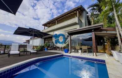 Imagem: A casa possui 1 Dormitório, 5 Banheiros, 4 Vagas na garagem