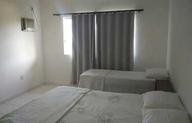 Imagem: A casa possui 2 Dormitórios e 1 Vaga na garagem e está localizado