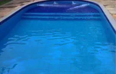 Imagem: A casa possui 3 Dormitórios e 5 Vagas na garagem e está localizado