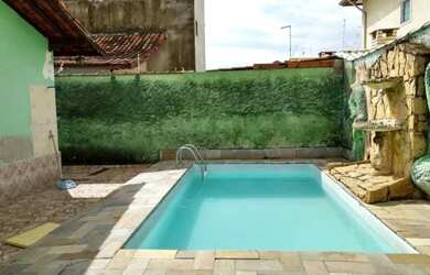 Imagem: A casa possui 4 Dormitórios, 3 Banheiros, 5 Vagas na garagem