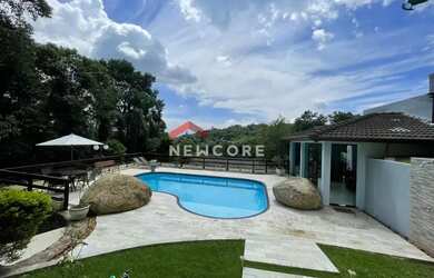 Imagem: A casa possui 3 Dormitórios, 5 Banheiros, 5 Vagas na garagem