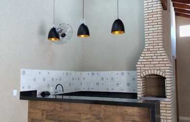 Imagem: A casa possui 2 Dormitórios, 3 Banheiros, 4 Vagas na garagem