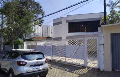 Imagem: A casa possui 3 Dormitórios, 4 Banheiros, 5 Vagas na garagem