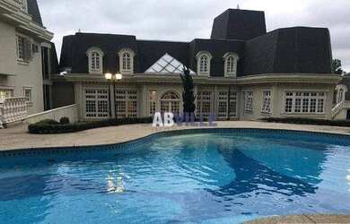 Imagem: A casa em condomínio possui 5 Dormitórios, 5 Banheiros, 5