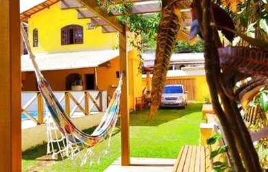 Imagem: A casa possui 4 Dormitórios e 4 Vagas na garagem e está localizado