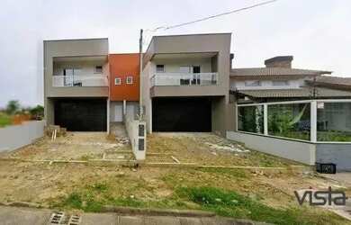 Imagem: A casa possui 3 Dormitórios, 1 Banheiro, 2 Vagas na garagem