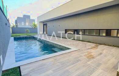 Imagem: A casa em condomínio possui 4 Dormitórios, 5 Banheiros e 287m²