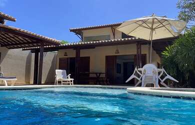 Imagem: A casa possui 5 Dormitórios, 2 Vagas na garagem, Churrasqueira