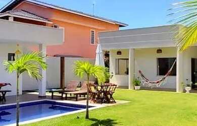 Imagem: A casa possui 3 Dormitórios, 4 Banheiros, 3 Vagas na garagem