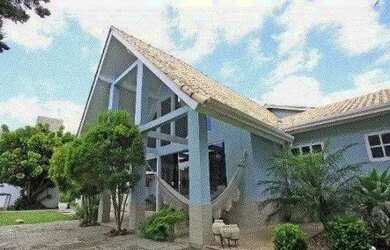 Imagem: A casa possui 4 Dormitórios, 4 Banheiros, 4 Vagas na garagem