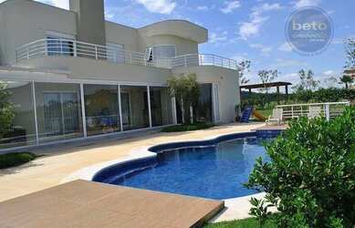 Imagem: A casa em condomínio possui 5 Dormitórios, 5 Banheiros, 2