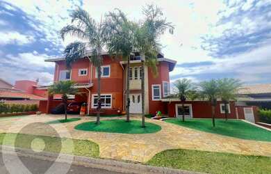 Imagem: A casa possui 4 Dormitórios, 5 Banheiros, 5 Vagas na garagem