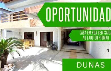 Imagem: A casa possui 4 Dormitórios, 5 Banheiros, 4 Vagas na garagem