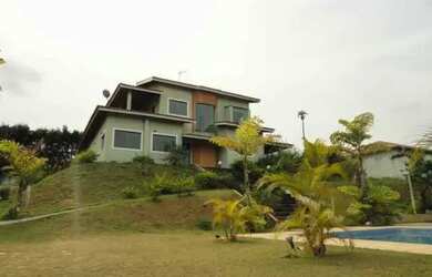 Imagem: A casa em condomínio possui 4 Dormitórios, 5 Banheiros, 5