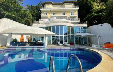 Imagem: A casa em condomínio possui 5 Dormitórios, 5 Banheiros, 5