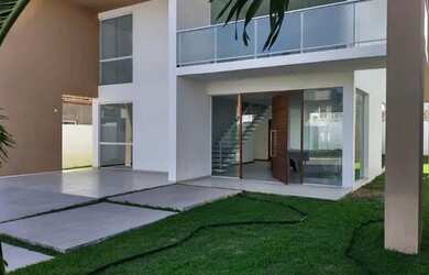 Imagem: A casa possui 4 Dormitórios, 5 Banheiros, 4 Vagas na garagem