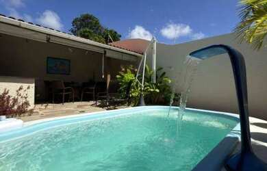 Imagem: A casa possui 3 Dormitórios, 4 Banheiros, 2 Vagas na garagem