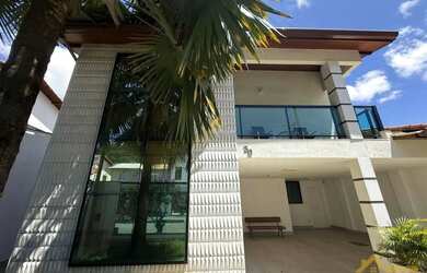 Imagem: A casa possui 4 Dormitórios, 5 Banheiros, 4 Vagas na garagem