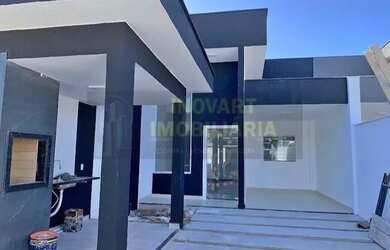 Imagem: A casa possui 3 Dormitórios, 2 Banheiros, 2 Vagas na garagem