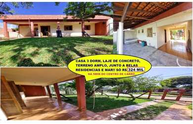 Imagem: A casa possui 3 Dormitórios, 2 Banheiros, 2 Vagas na garagem