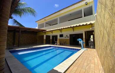 Imagem: A casa possui 5 Dormitórios, 5 Banheiros, 4 Vagas na garagem