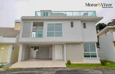 Imagem: A casa possui 4 Dormitórios, 5 Banheiros, 4 Vagas na garagem