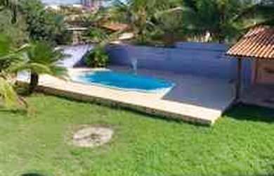 Imagem: A casa possui 3 Dormitórios, 4 Banheiros, 5 Vagas na garagem